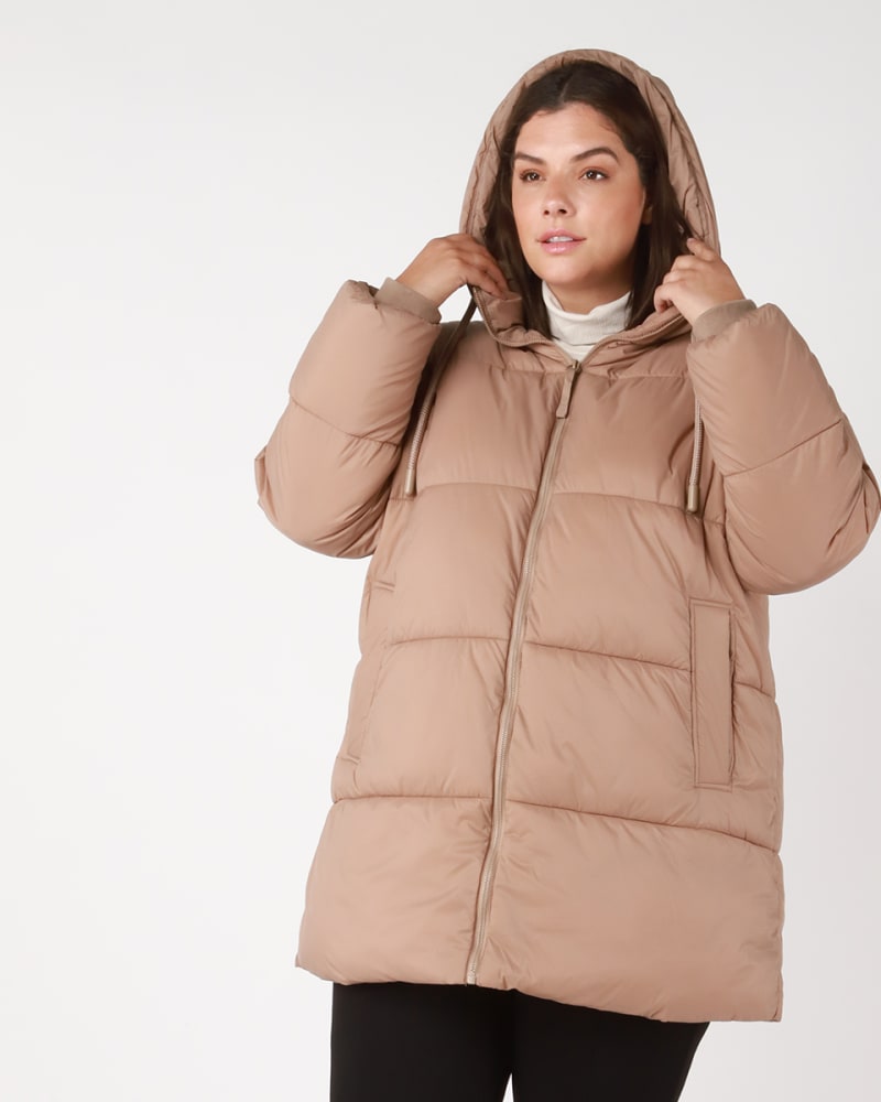 Front of a model wearing a size 0X Kaiya Hooded Puffer in Beige by DEX PLUS. | dia_product_style_image_id:235438